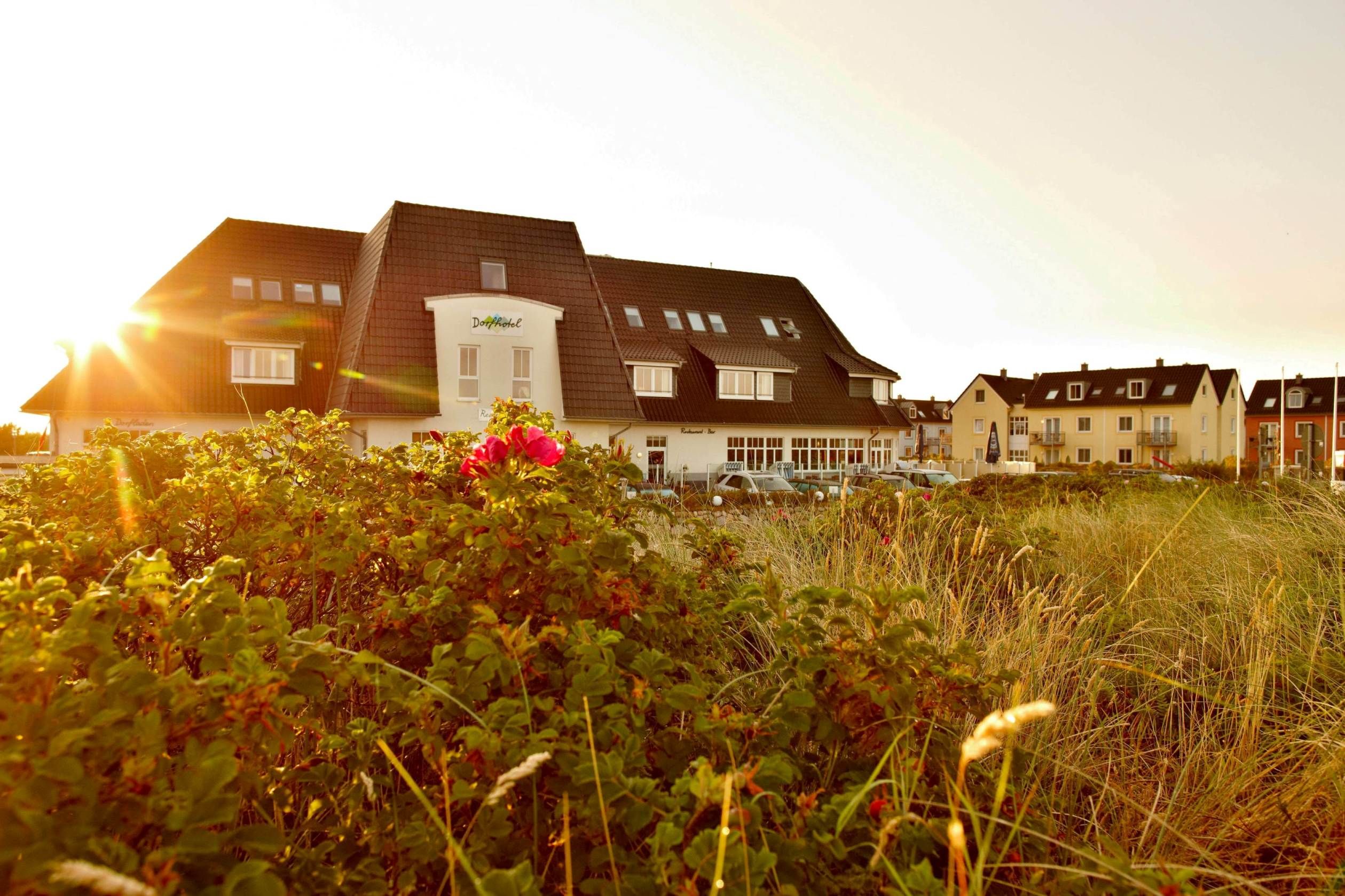 main house of the dorfhotel in the sunlight